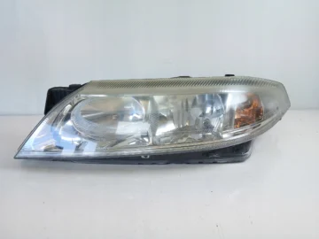 RENAULT LAGUNA II LAMPA LEWA PRZÓD 7701048927